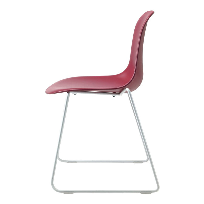 Side view of a sleek, modern chair in deep burgundy with a minimalist silver base. Perfect for contemporary decor.