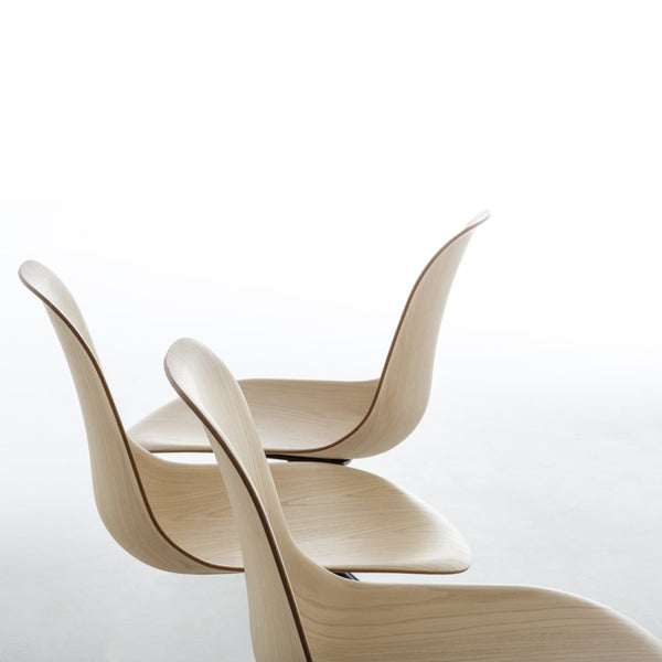 Stylish minimalist chairs in natural wood finish with smooth curves and subtle grain patterns. Perfect for modern decor.
