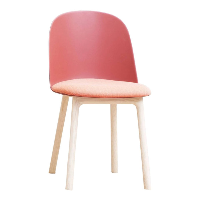Modern chair featuring a pink backrest, peach seat, and light wood legs for a fresh, stylish look.