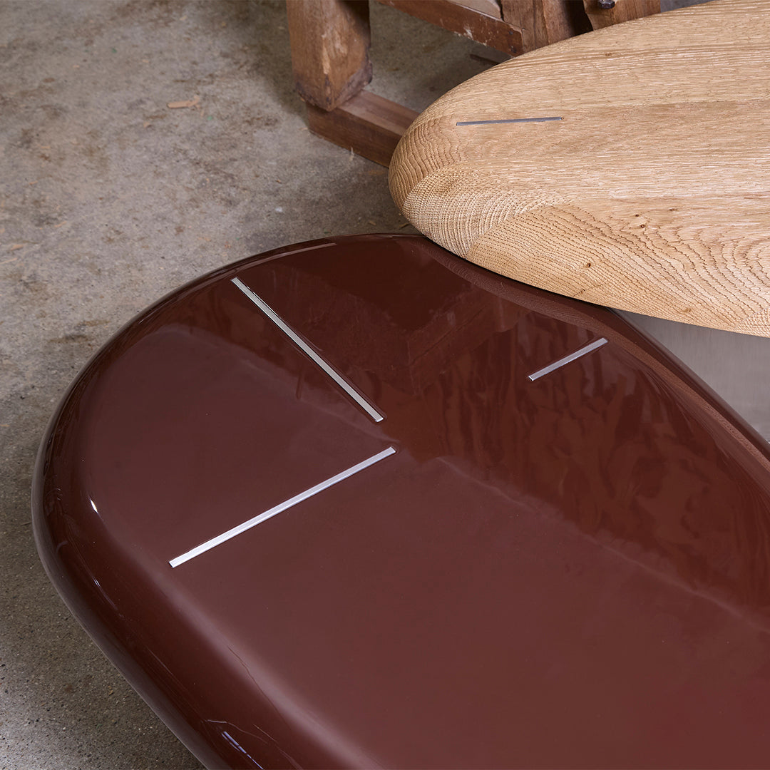 Brown glossy surface with white linear patterns, complemented by a natural wood texture. Ideal for modern decor.