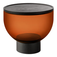 Amber glass bowl with a black wooden top and a matte black base, creating a modern, sleek design.