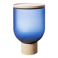 Blue glass lamp with a smooth gradient, featuring a natural wood top and a light-colored wooden base.