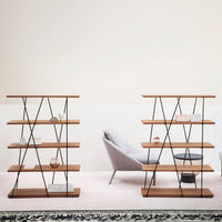 Wooden shelving units with black metal accents, featuring a warm brown finish and geometric patterns against a light backdrop.