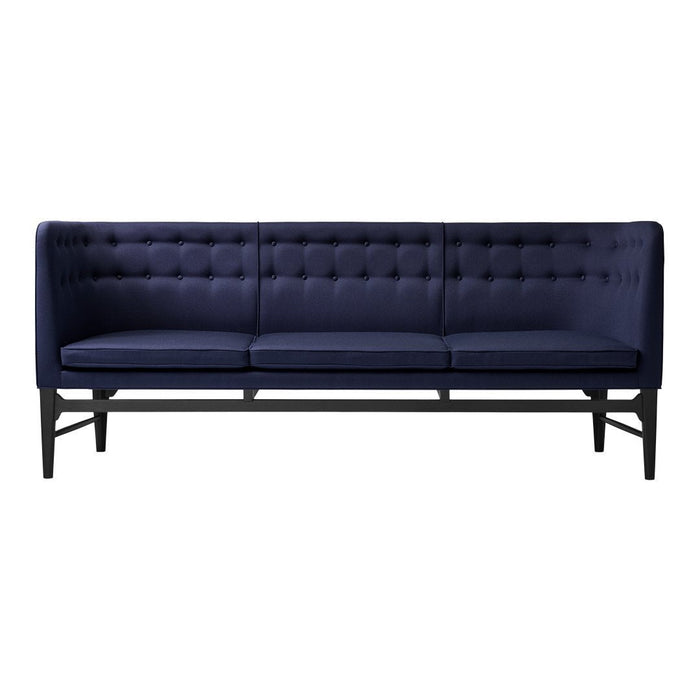 Navy blue tufted sofa with black wooden legs, featuring a sleek, modern design and solid color pattern.