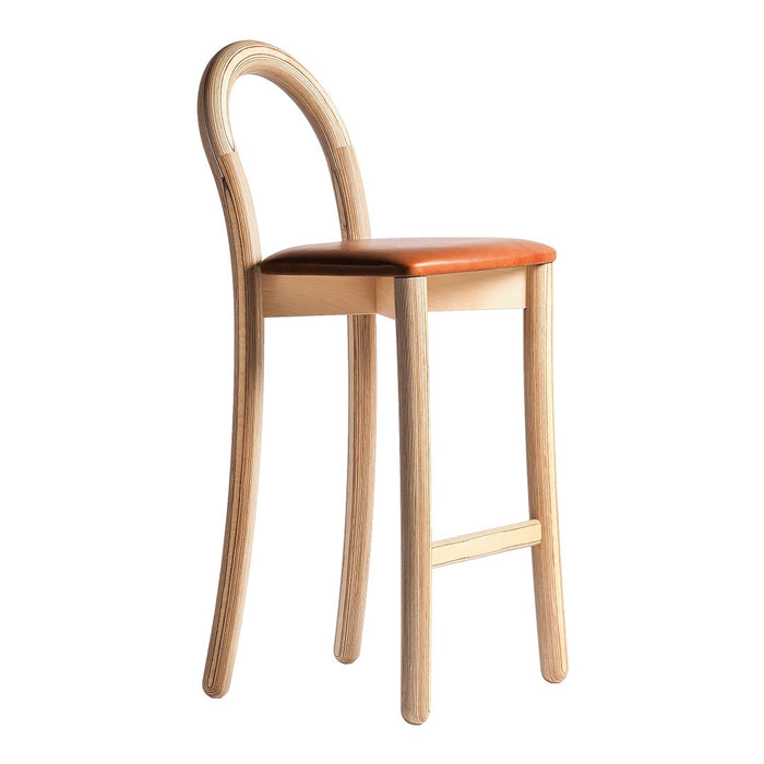 Light wood bar stool with smooth curves and a warm brown leather seat, featuring a minimalist design.