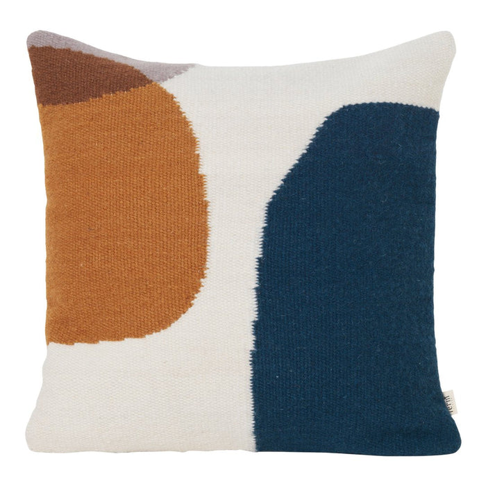 Abstract patterned pillow in earthy orange, deep teal, and cream, perfect for modern decor accents.