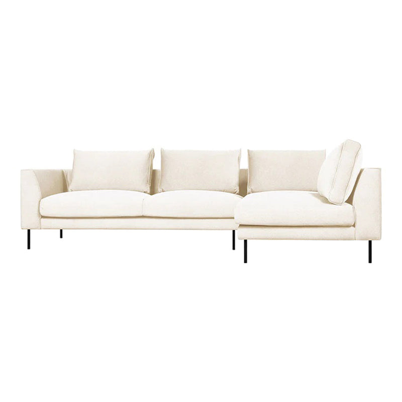 Cream-colored sofa with a sleek design and plush cushions, featuring a minimalist aesthetic and black metal legs.