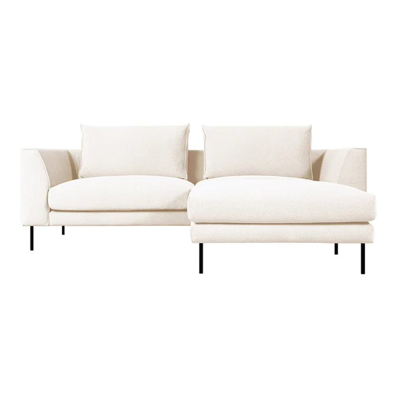Soft beige sofa with minimalist design, featuring clean lines and plush cushions, ideal for modern decor.