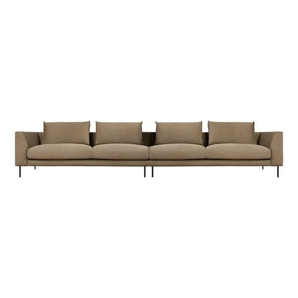 Beige sectional sofa with clean lines, featuring plush cushions and minimalist design on slender black legs.