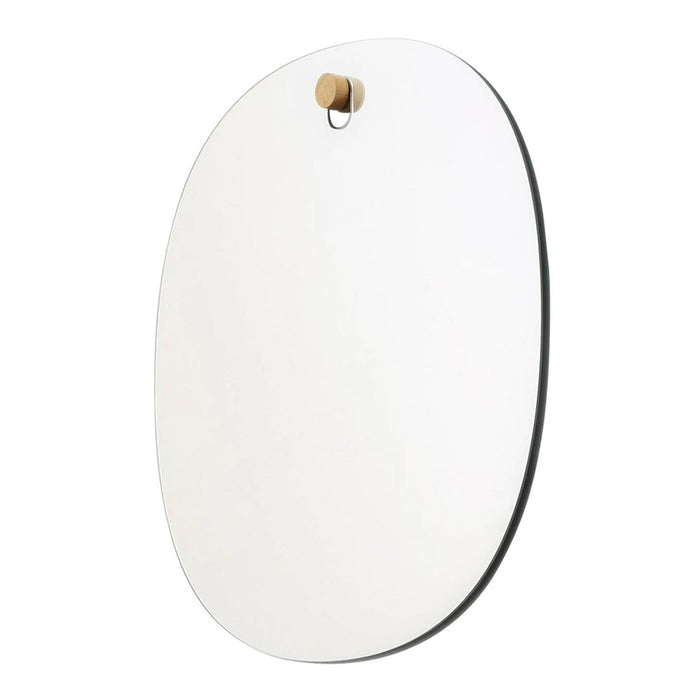 Oval wall mirror with a sleek, minimalist design and a natural wood hook. Features a smooth, reflective surface.