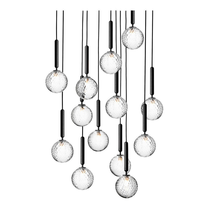 Elegant black and glass pendant lights featuring round, textured globes, creating a modern, stylish pattern.