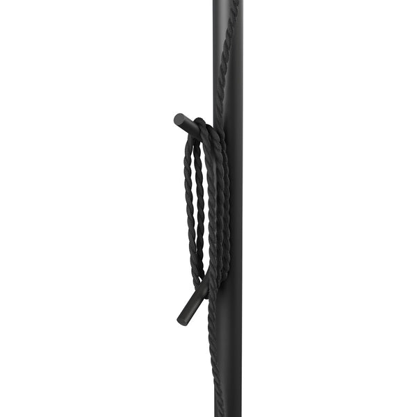 Black sturdy pole with braided black rope neatly coiled around it, showcasing a sleek, minimalist design.