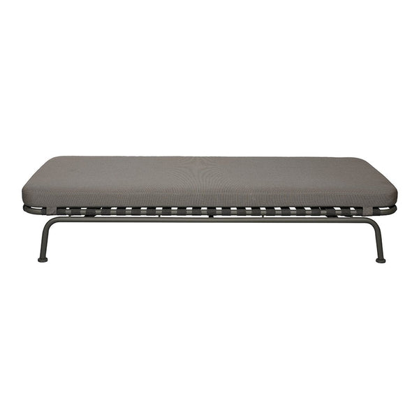 Gray cot with a smooth, solid surface and a sleek, black metal frame. Modern and minimalist design.
