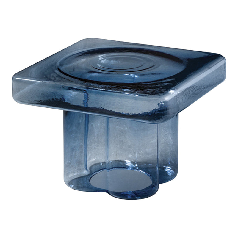 Clear blue glass decorative piece with a square shape and circular pattern on top. Elegant and modern design.