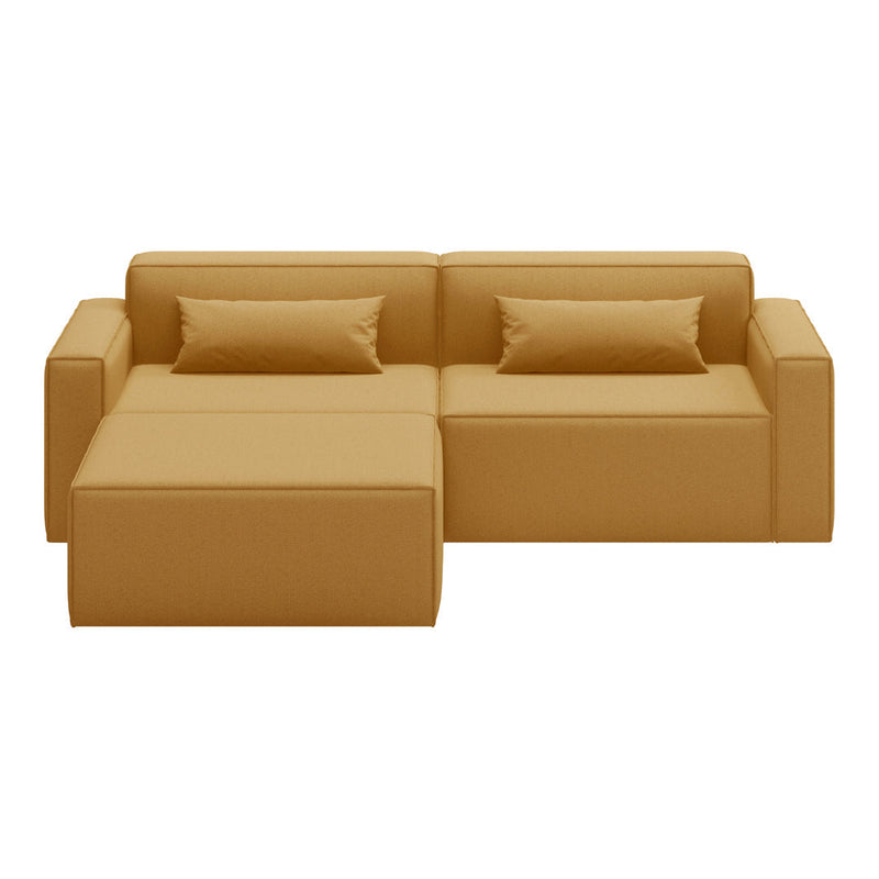 "Modern tan sofa with clean lines and coordinated cushions, perfect for a contemporary living space."