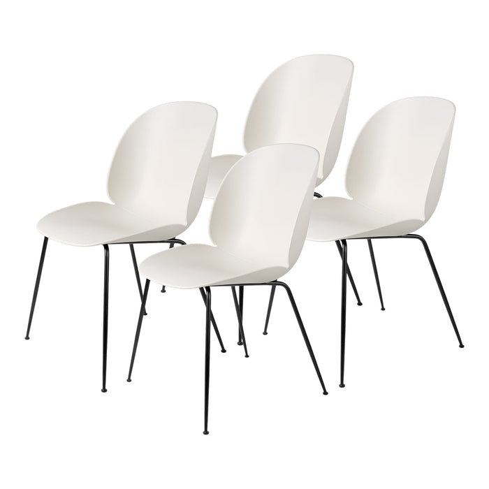 Set of four sleek white chairs with minimalist design and black metal legs, perfect for modern decor.