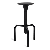 Modern black stool with a sleek, minimalist design and smooth circular top, ideal for contemporary decor.
