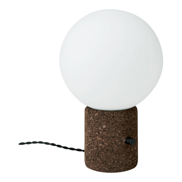 White globe lamp with a textured brown cork base and black twisted cord, creating a modern, minimalist aesthetic.