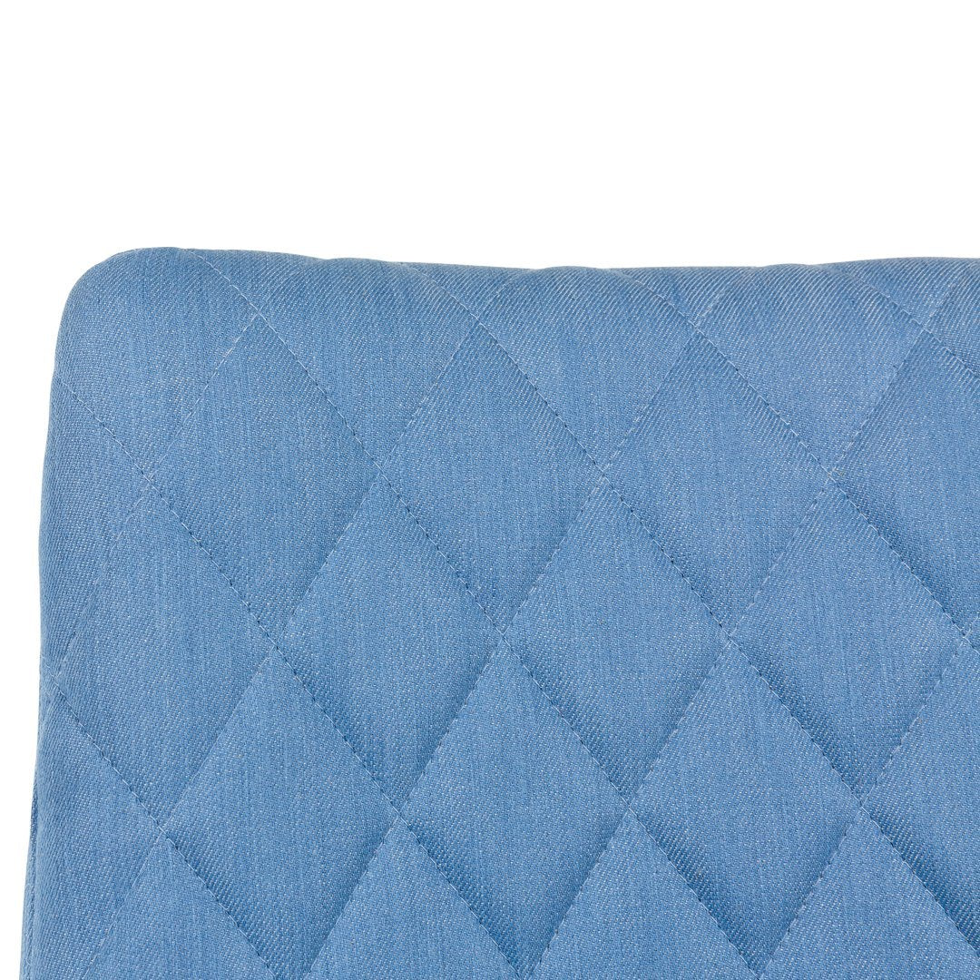 Light blue quilted cushion with a diamond pattern, adding a stylish touch to any décor.