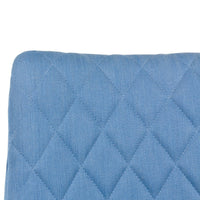 Light blue quilted cushion with a diamond pattern, adding a stylish touch to any décor.