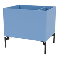 Light blue planter box with a minimalist design and black metal legs, adding a modern touch to any space.