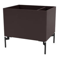 Dark brown planter with sleek black metal legs, featuring a modern and minimalist design.