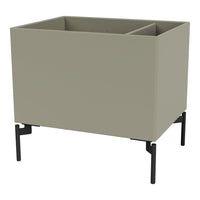 Sleek gray planter with minimalistic design, featuring a smooth surface and sturdy black legs.