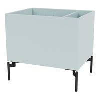 Light blue rectangular planter with minimalist design and black metal legs. Ideal for modern decor.