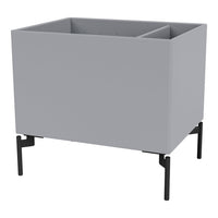 Gray planter box with a smooth finish and black metal legs, featuring a minimalist and modern design.
