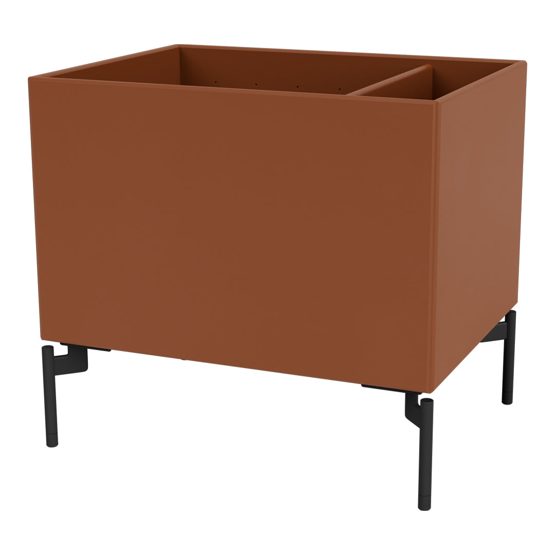 Rust-colored planter with a matte finish and sleek black metal legs, featuring a simple, modern design.
