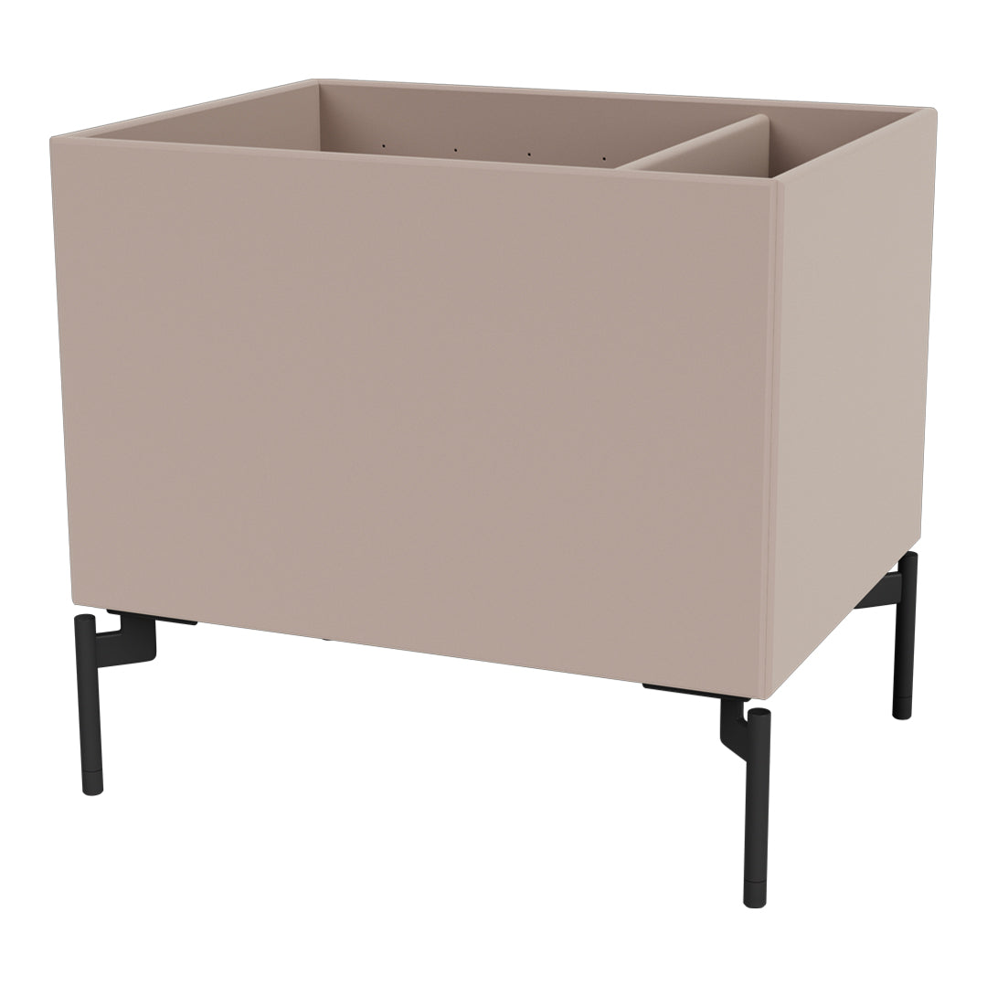 "Modern blush planter box with black metal legs; minimalist design for stylish indoor or outdoor decor."
