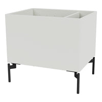 Modern white planter box with a sleek design, featuring a matte finish and contrasting black metal legs.