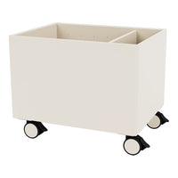Cream-colored storage bin on wheels with a smooth, minimalist design. Features two separate compartments for organization.