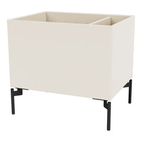 "Modern cream planter with a sleek black metal stand; minimalistic design perfect for contemporary decor."