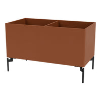 Rustic terracotta planter box with sleek black metal legs, featuring a minimalist design and smooth surface.