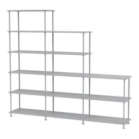 Gray metal shelving unit with a modern, staggered design and sleek, minimalistic lines.