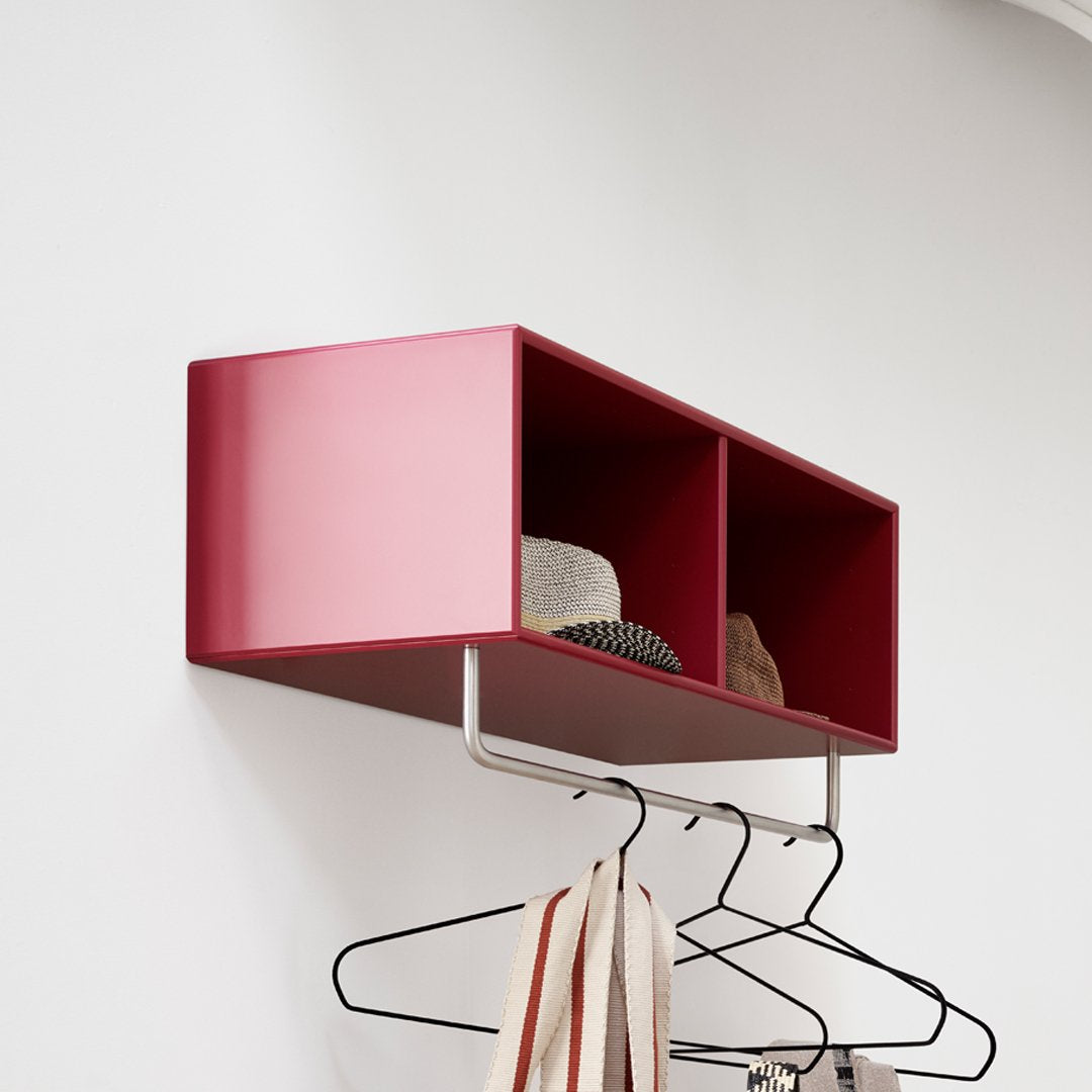 Glossy burgundy wall-mounted shelf with two compartments, featuring hats and a minimalistic silver hanger.