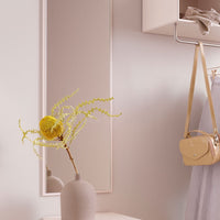 "Soft beige and pastel tones with vibrant yellow accents in a modern interior decor setting."