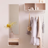 Modern minimalist wall setup featuring soft pinks, neutrals, and textured fabrics. Chic pastel color palette.