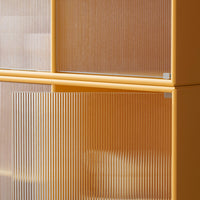 Translucent orange cabinet with vertical ribbed design and a smooth yellow frame, adding a modern touch to any space.