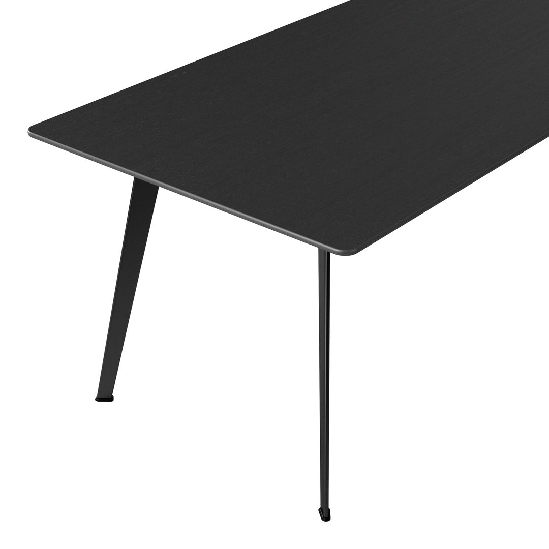 Sleek black tabletop with a matte finish and slim black legs, perfect for modern decor.