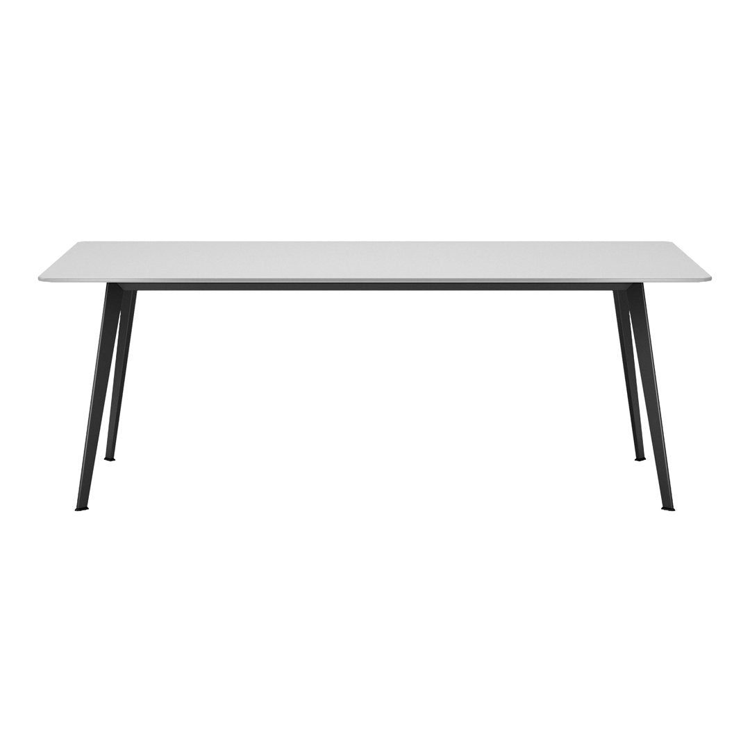Modern white tabletop paired with sleek black legs, featuring a minimalist design and clean lines for contemporary decor.