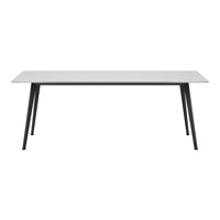 Modern white tabletop paired with sleek black legs, featuring a minimalist design and clean lines for contemporary decor.