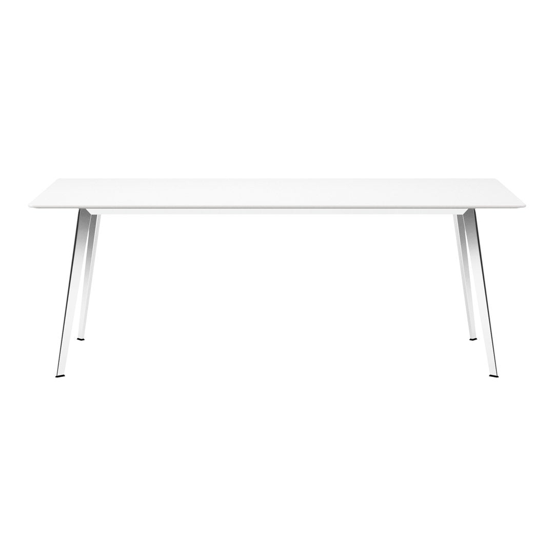 Sleek white table with minimalistic design and shiny silver legs, perfect for modern decor.