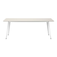 Modern white dining table with a sleek, smooth surface and minimalist design, perfect for contemporary decor.