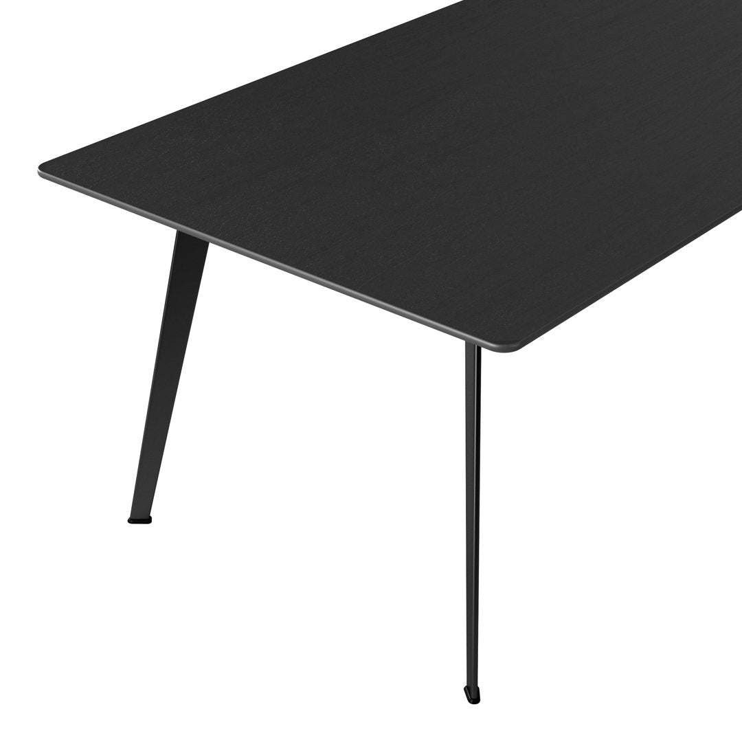 Sleek black tabletop with minimalist design and matte finish, supported by slim black legs. Perfect for modern interiors.