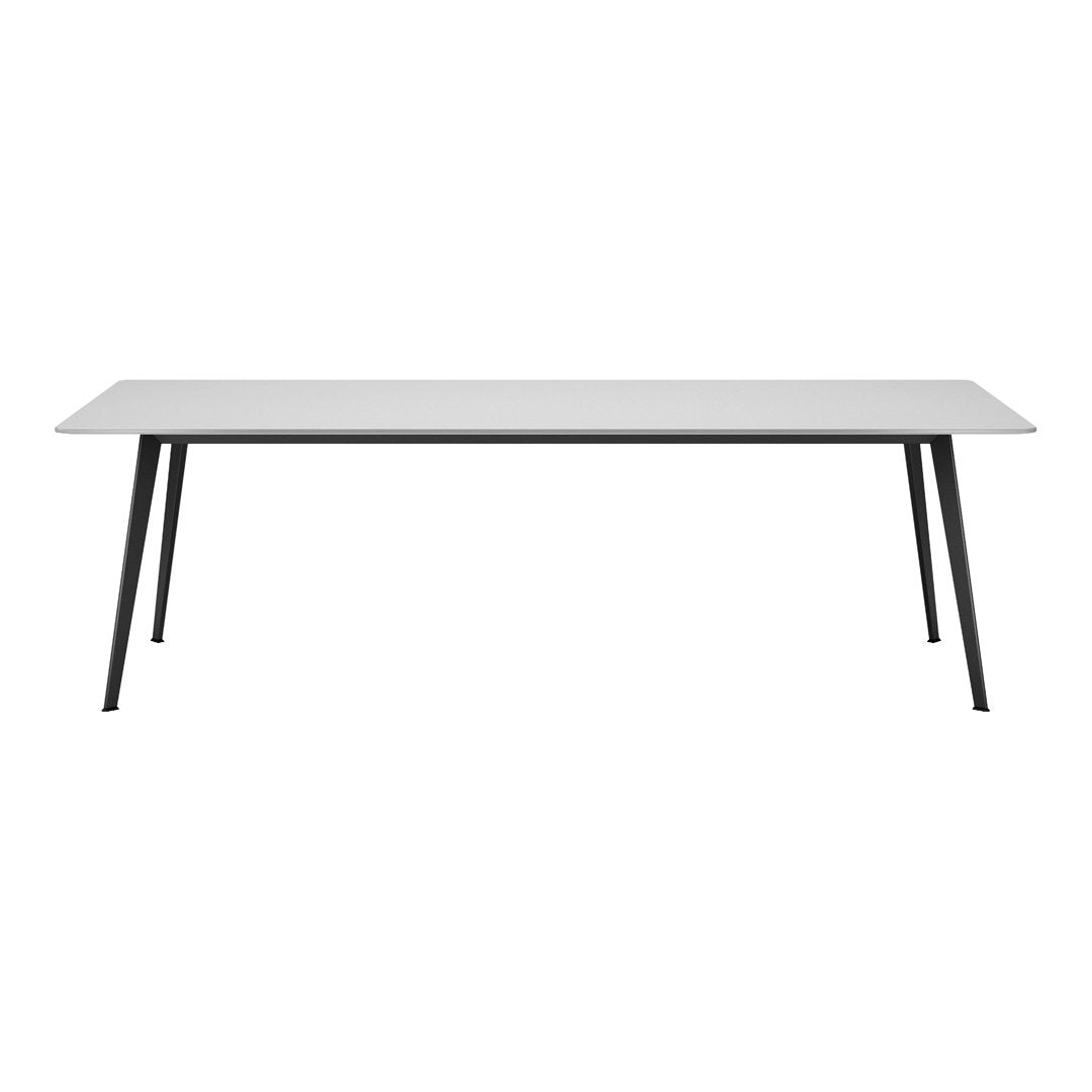Rectangular table with a white surface and black legs on a white background