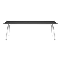 Sleek black tabletop with modern silver legs, perfect for a contemporary design aesthetic.