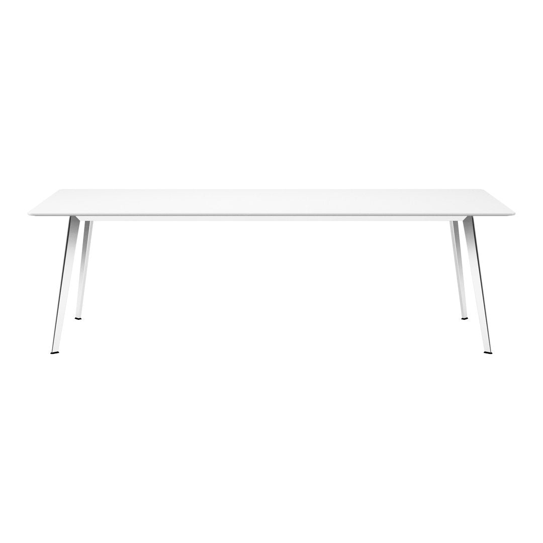 Sleek, modern white table with minimalist design and silver metal legs. Perfect for contemporary decor.