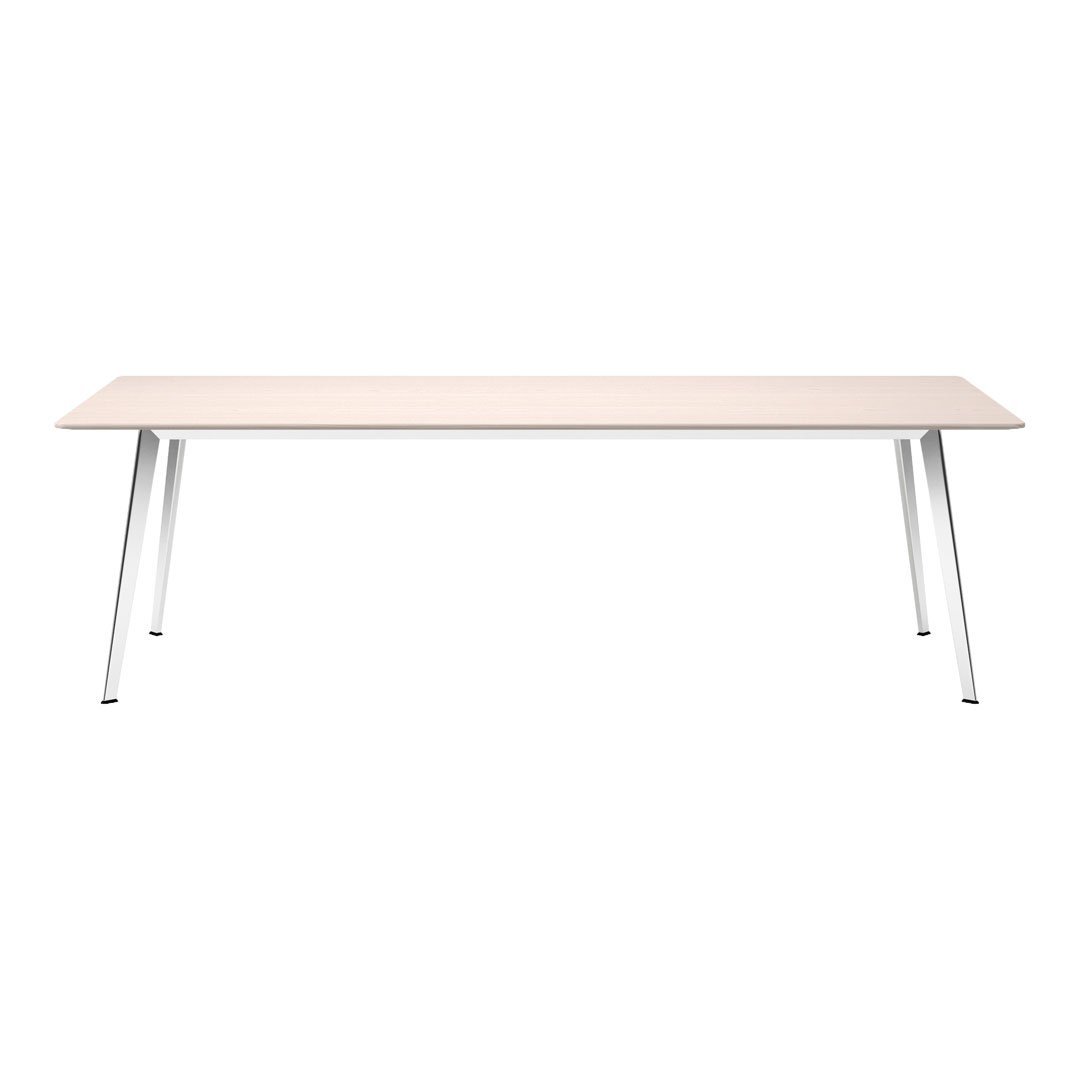 Light wood table with a smooth surface, featuring sleek silver legs for a modern, minimalist design.